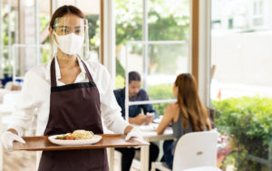 Asian waitress serving food new normal.
